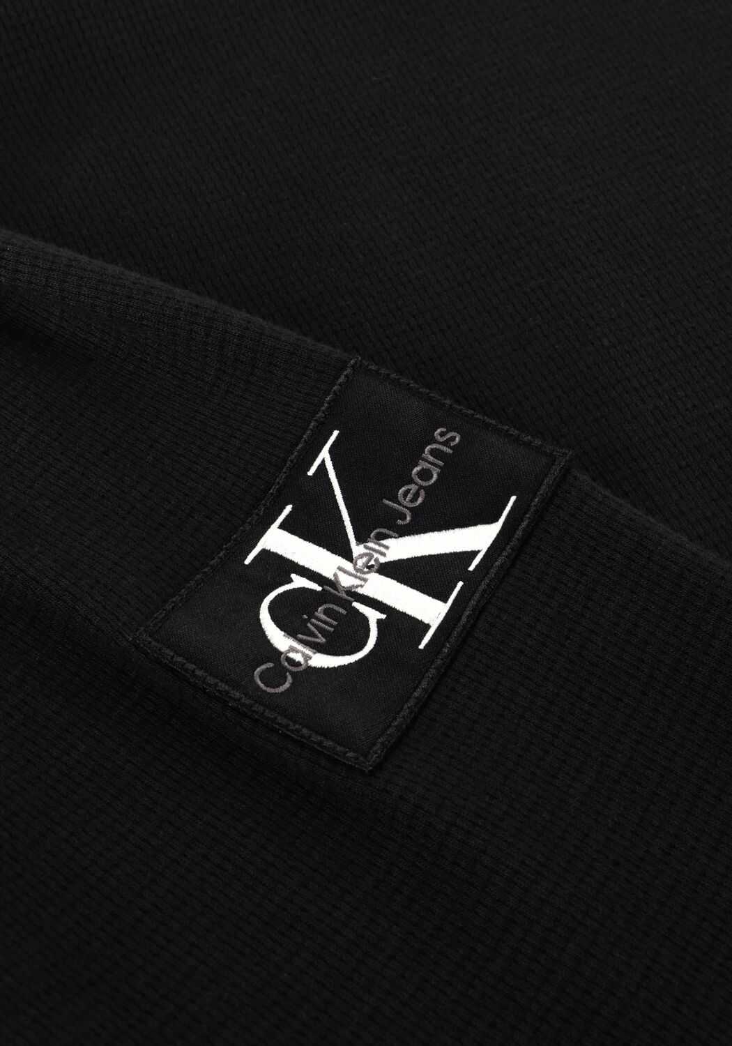 CALVIN KLEIN Polo BADGE WAFFLE LS TEE en noir - large