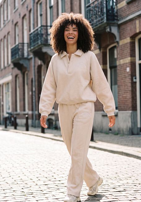 Beige THE LOLA CLUB Flared broek EBONY PANTS - large
