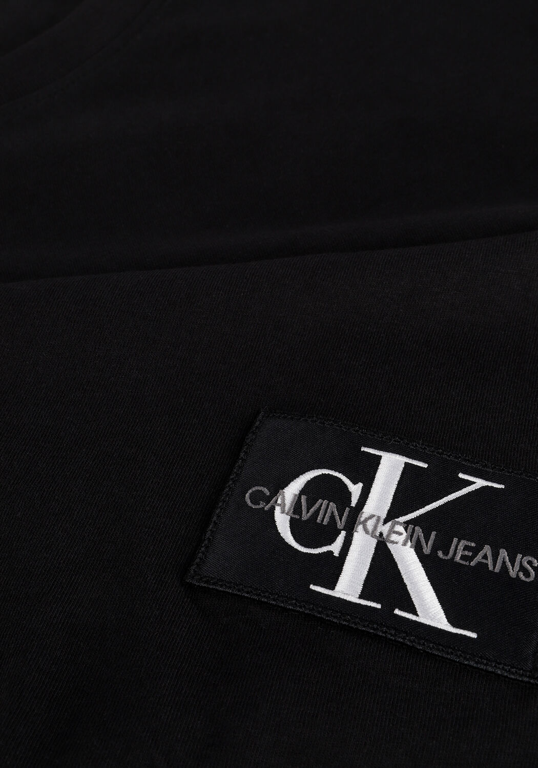 CALVIN KLEIN T-shirt MONOGRAM BADGE LS ROUND HEM TEE en noir - large
