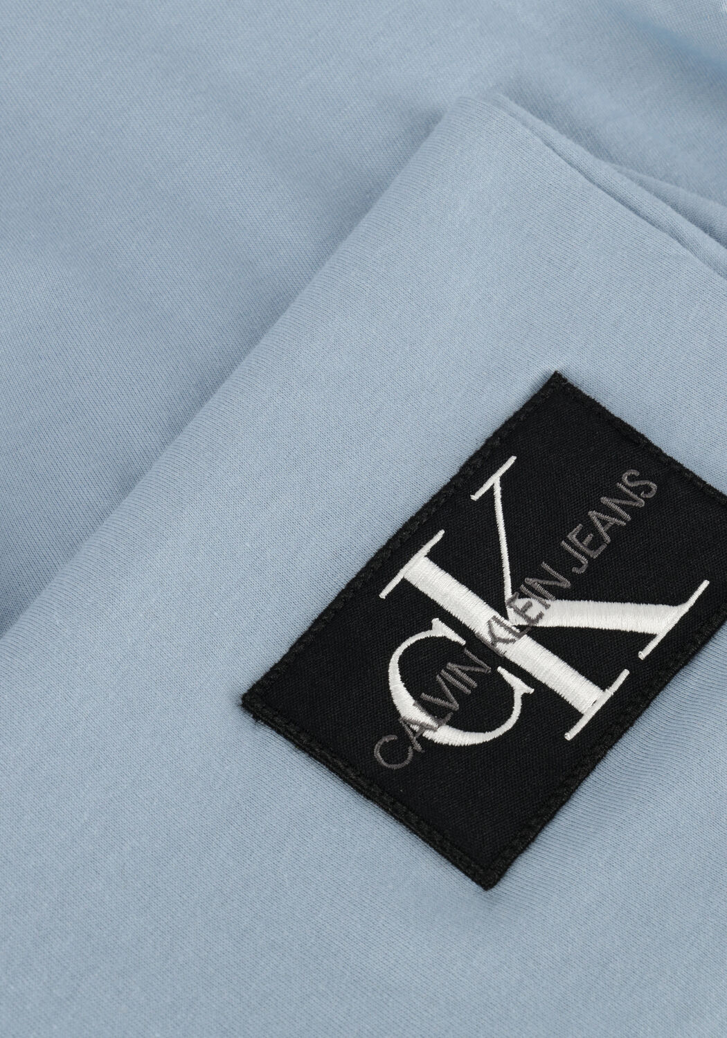 CALVIN KLEIN T-shirt BADGE TURN UP SLEEVE en bleu - large