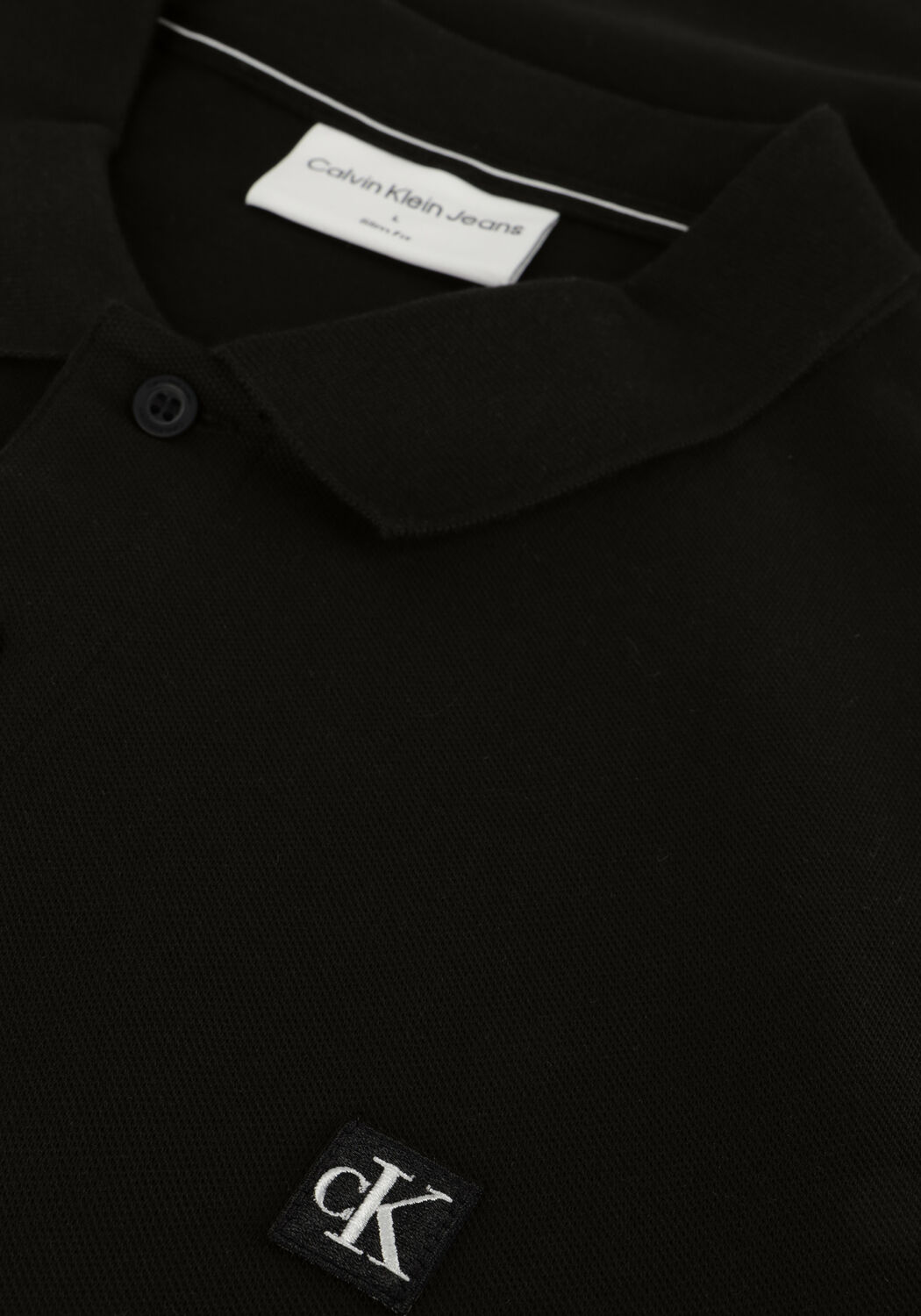 CALVIN KLEIN Polo CK EMBRO BADGE SLIM POLO en noir - large