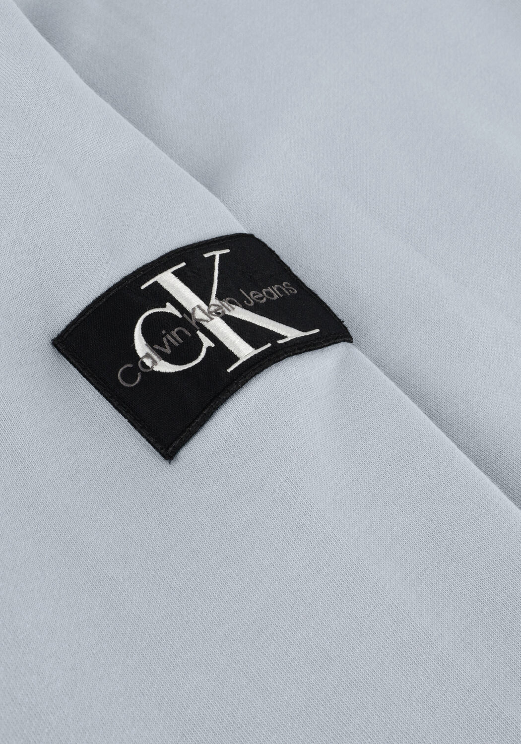 CALVIN KLEIN Chandail WASHED BADGE CREW NECK en bleu - large