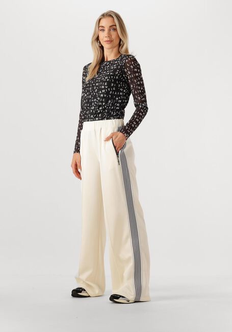 HAUTE L'AMITIÉ Pantalon de jogging BAGGY TRACK TALL PANTS en blanc - large