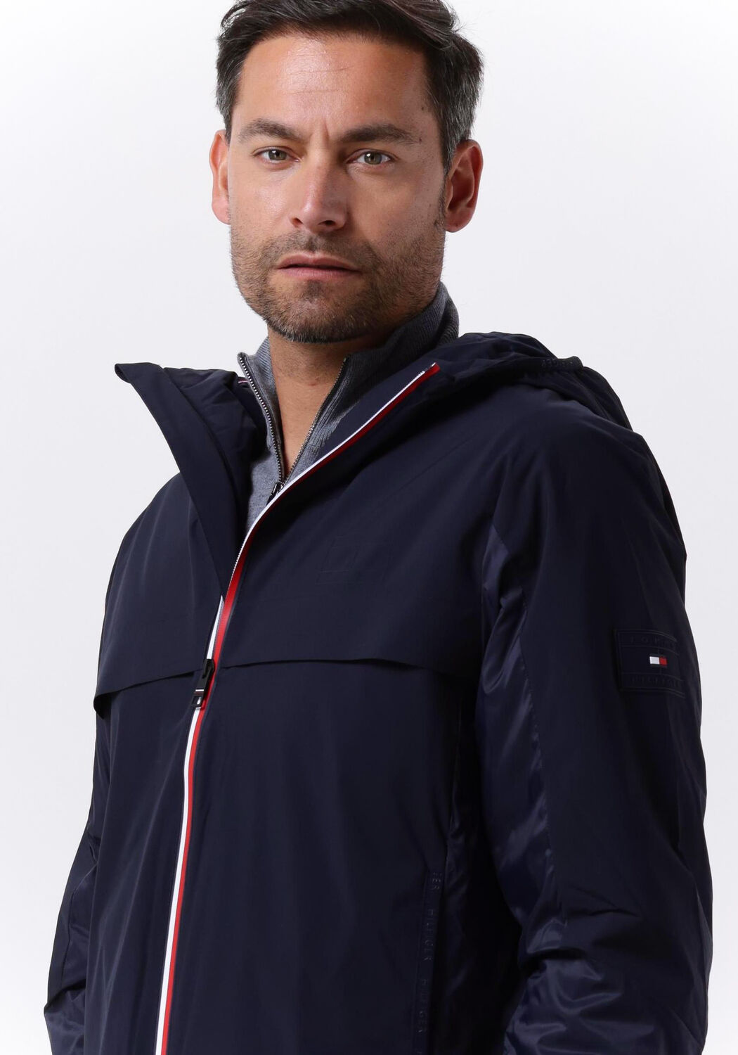 donkerblauwe tommy hilfiger regenjas tech hooded rwb zip jacket