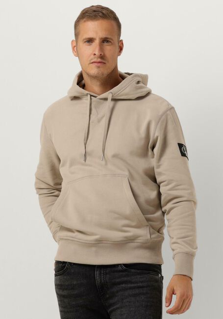 CALVIN KLEIN Chandail BADGE HOODIE en beige - large