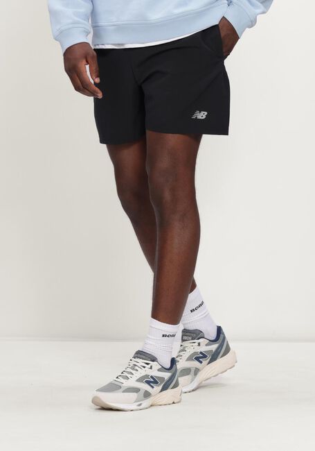 NEW BALANCE Pantalon courte TRACKSIDE FRENCH TERRY SHORT 7 Bleu fonc&eacute; - large