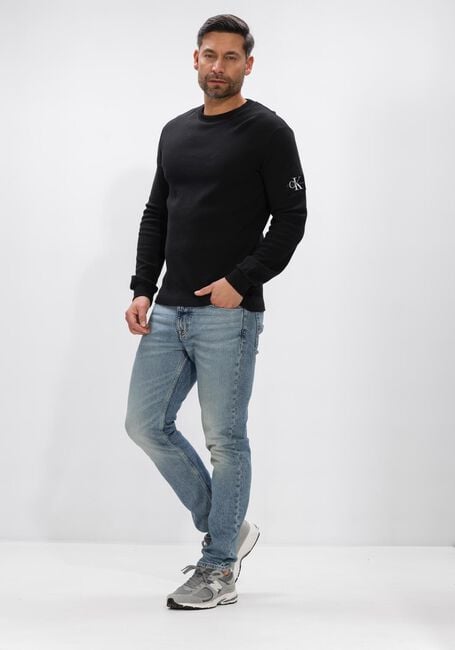 CALVIN KLEIN Polo BADGE WAFFLE LS TEE en noir - large