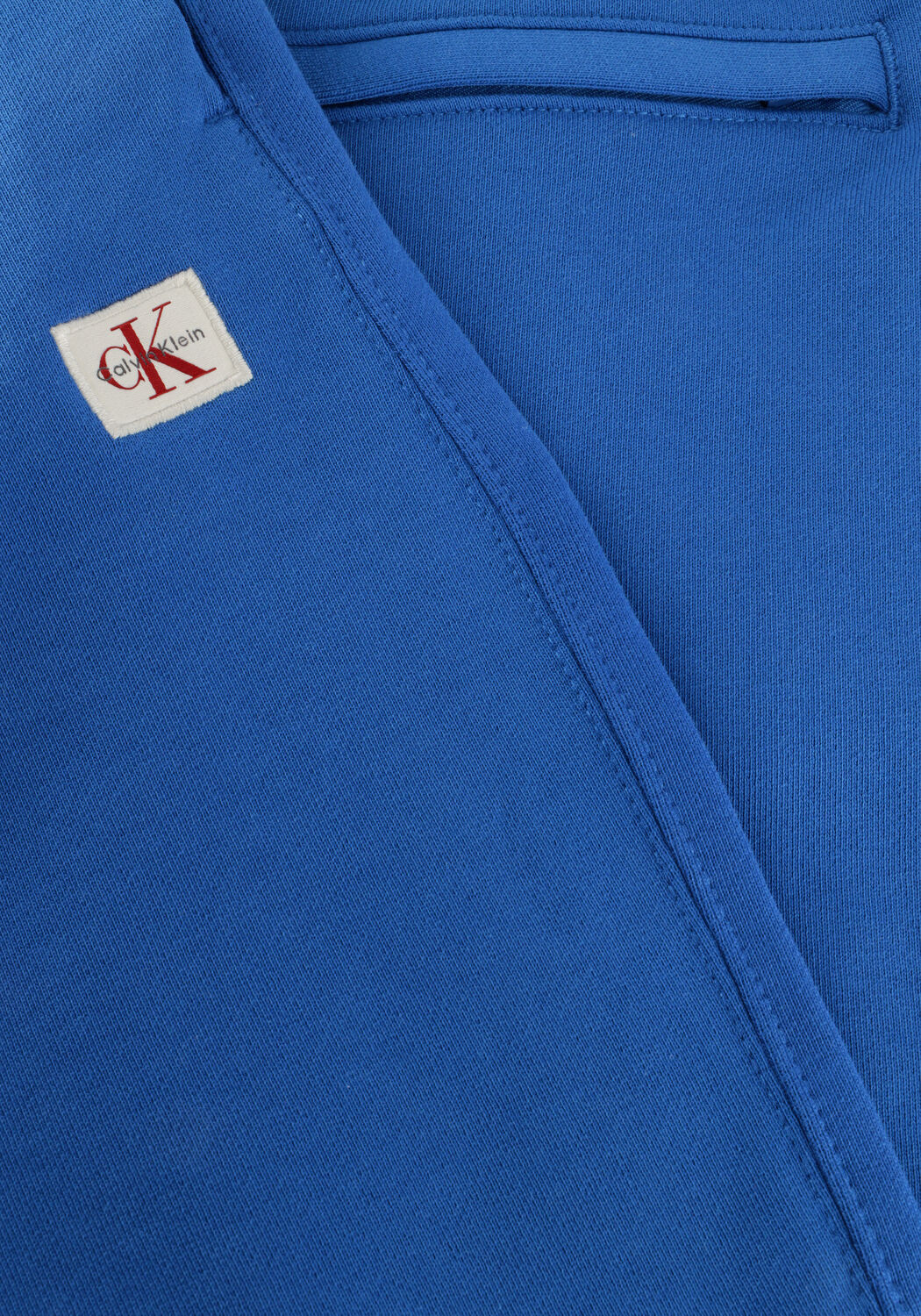 CALVIN KLEIN Pantalon courte EU 350TERRY BADGE SHORT en bleu - large